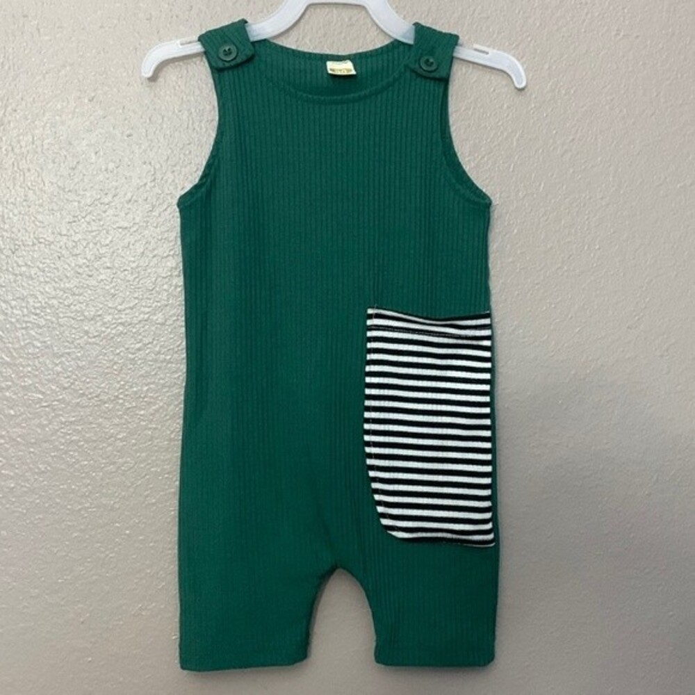 One piece unisex baby romper, color green with black/white pocket. 6-9 months